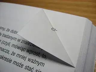 Photo of a dog-eared book from Wikimedia Commons, GFDL by Derbeth