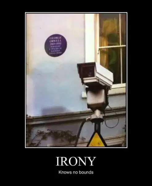 A picture of a building with a plaque denoting that George Orwell once lived in the building. Beside the plaque is a CCTV camera. Beneath the photo is the caption "Irony knows no bounds"