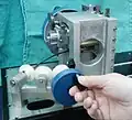 13. Remove the supporting block and check that coarse adjustment works smoothly over the full range between green and red lines near the front of the cylinder.