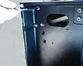 2. Remove the screw fastening the side cover at the rear of the machine.