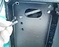 3. Remove the screw fastening the middle cover at the left rear corner.