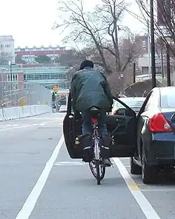 Beware of cycling lanes located next to parking spaces, as dooring is very common in this situation.