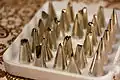 An assortment of metal piping tips