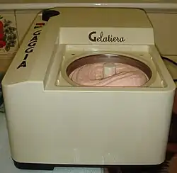 Electrically-powered machine chilled with a compressor