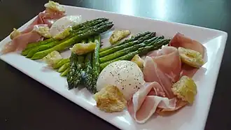 Plated dish garnished with croutons