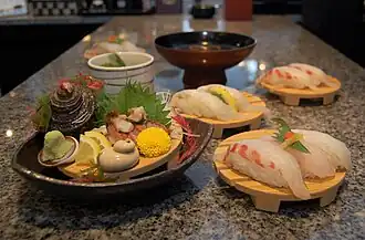 Sushi accompanied by shiso leaves