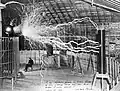 Photo of Nikola Tesla in his Colorado Springs lab around 1899. Tesla's work on AC current, wireless communication, and motors would help pave the way for consumer electronics, and the video game industry by extension.