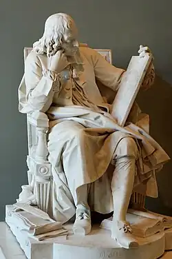 Blaise Pascal (1623–1662) studying the cycloid, engraved on the tablet he is holding in his left hand; the scattered papers at his feet are his Pensées, the open book his Lettres provinciales. Exhibited at the Salon of 1785; the plaster model was exhibited at the Salon of 1781.
