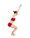 Utkatasana is a yoga asana meaning Chair Pose, sometimes but not always with both hands up.