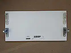 An Utrusta drawer front; the white plastic brackets are only being used on medium and high drawers.