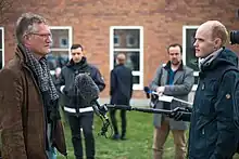 Anders Tegnell being interviewed by a reporter from a TV news station.
