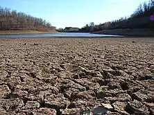 A dry lakebed in California, which is experiencing its worst megadrought in 1,200 years..mw-parser-output cite.citation{font-style:inherit;word-wrap:break-word}.mw-parser-output .citation q{quotes:"\"""\"""'""'"}.mw-parser-output .citation:target{background-color:rgba(0,127,255,0.133)}.mw-parser-output .id-lock-free.id-lock-free a{background:url("//upload.wikimedia.org/wikipedia/commons/6/65/Lock-green.svg")right 0.1em center/9px no-repeat}.mw-parser-output .id-lock-limited.id-lock-limited a,.mw-parser-output .id-lock-registration.id-lock-registration a{background:url("//upload.wikimedia.org/wikipedia/commons/d/d6/Lock-gray-alt-2.svg")right 0.1em center/9px no-repeat}.mw-parser-output .id-lock-subscription.id-lock-subscription a{background:url("//upload.wikimedia.org/wikipedia/commons/a/aa/Lock-red-alt-2.svg")right 0.1em center/9px no-repeat}.mw-parser-output .cs1-ws-icon a{background:url("//upload.wikimedia.org/wikipedia/commons/4/4c/Wikisource-logo.svg")right 0.1em center/12px no-repeat}body:not(.skin-timeless):not(.skin-minerva) .mw-parser-output .id-lock-free a,body:not(.skin-timeless):not(.skin-minerva) .mw-parser-output .id-lock-limited a,body:not(.skin-timeless):not(.skin-minerva) .mw-parser-output .id-lock-registration a,body:not(.skin-timeless):not(.skin-minerva) .mw-parser-output .id-lock-subscription a,body:not(.skin-timeless):not(.skin-minerva) .mw-parser-output .cs1-ws-icon a{background-size:contain;padding:0 1em 0 0}.mw-parser-output .cs1-code{color:inherit;background:inherit;border:none;padding:inherit}.mw-parser-output .cs1-hidden-error{display:none;color:var(--color-error,#d33)}.mw-parser-output .cs1-visible-error{color:var(--color-error,#d33)}.mw-parser-output .cs1-maint{display:none;color:#085;margin-left:0.3em}.mw-parser-output .cs1-kern-left{padding-left:0.2em}.mw-parser-output .cs1-kern-right{padding-right:0.2em}.mw-parser-output .citation .mw-selflink{font-weight:inherit}@media screen{.mw-parser-output .cs1-format{font-size:95%}html.skin-theme-clientpref-night .mw-parser-output .cs1-maint{color:#18911f}}@media screen and (prefers-color-scheme:dark){html.skin-theme-clientpref-os .mw-parser-output .cs1-maint{color:#18911f}}Ivanova, Irina (June 2, 2022). "California is rationing water amid its worst drought in 1,200 years". CBS News.