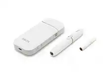 IQOS, consisting of a charger, holder, and tobacco stick.