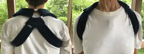 A cloth brace to hold the scapulas in retraction to reduce shoulder symptoms, such as collarbone pain