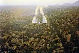 A Fairchild C-123 Provider aircraft spraying defoliant in South Vietnam in 1962.