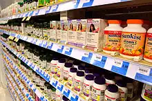 Rows and rows of dietary supplement bottles on shelves