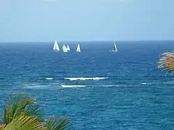 The yachts pass 3 km off shore well clear of the Fathom in the Round Barbados race 2013.
